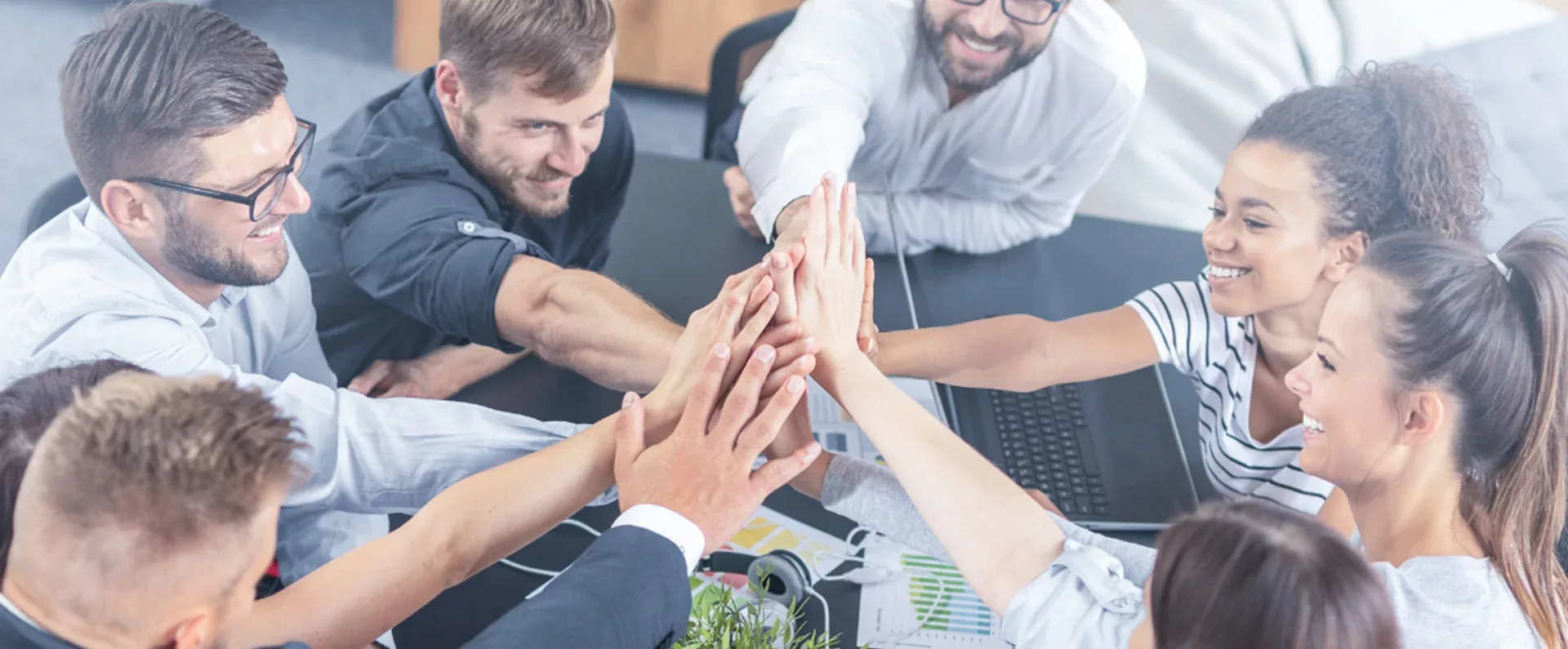 Office team group high-fiving