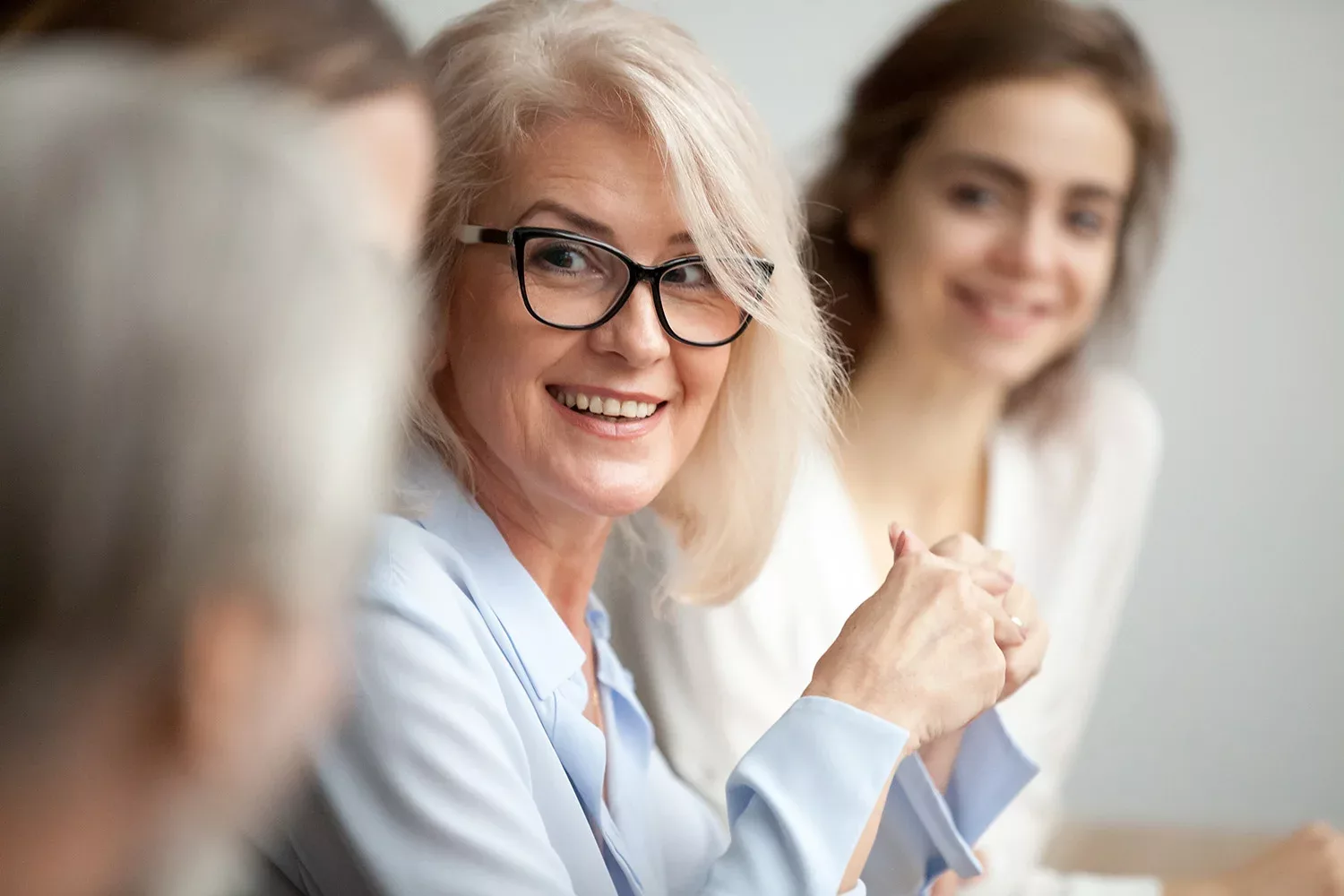 Woman leads office meeting