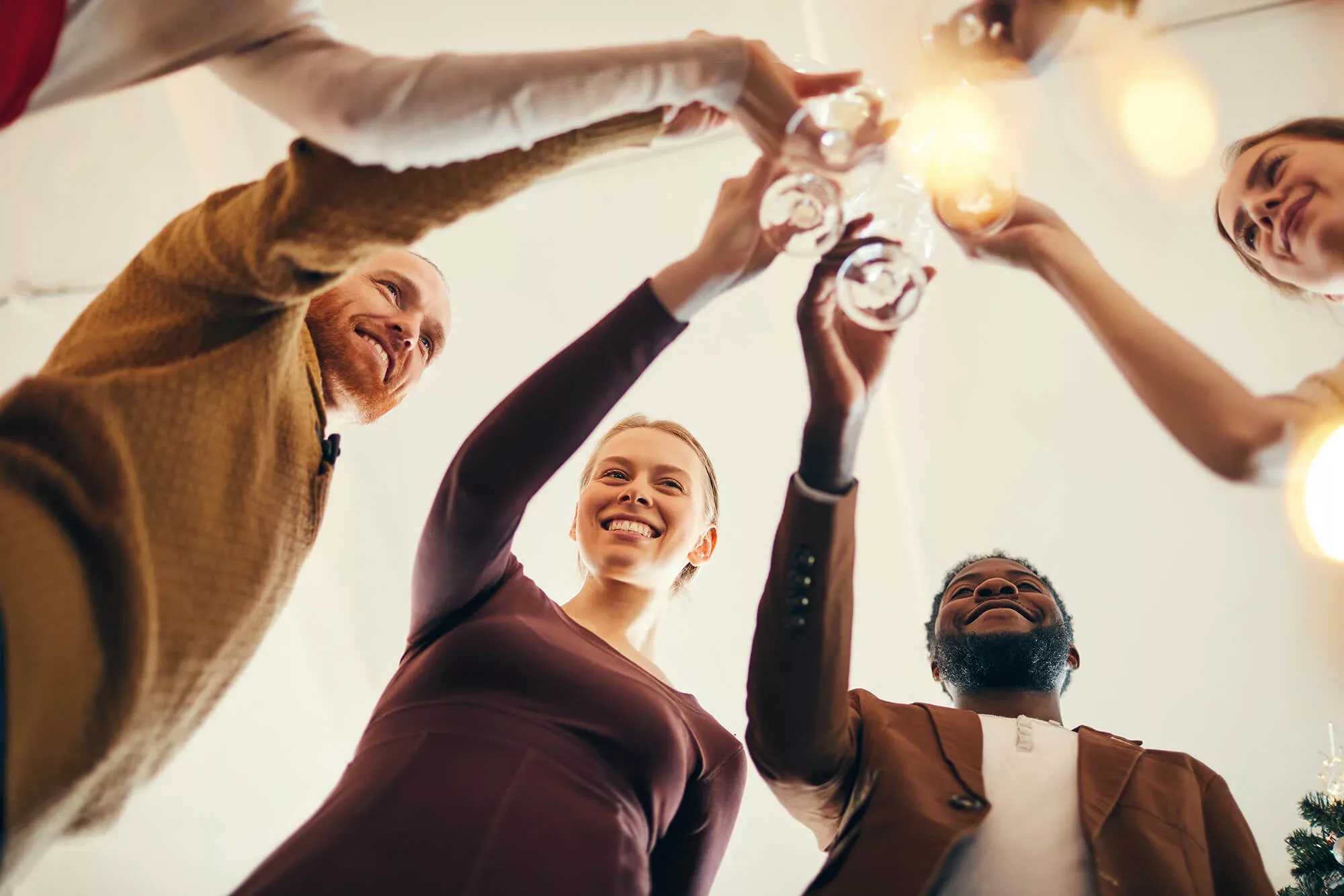 Office workers toasting at office party